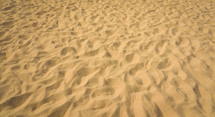 closeup of sand pattern of a beach in the summer