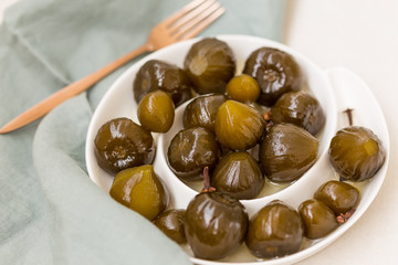 Closeup shot of fig jam in whtie ceramic plate