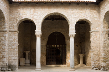 Fototapeta na wymiar One of sides of the atrium in the architectural complex of the Euphrasian Basilica in Porec