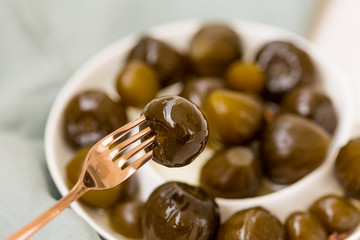 Closeup shot of a fork holding a fig jam
