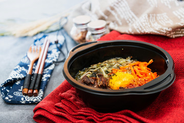Bibimbap Rice, vegetables, minced marinated beef, spicy sauce and egg yolk