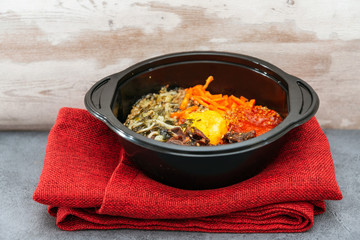Bibimbap Rice, vegetables, minced marinated beef, spicy sauce and egg yolk