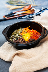 Bibimbap Rice, vegetables, minced marinated beef, spicy sauce and egg yolk