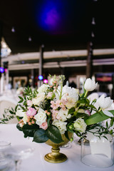 Flower arrangement on the table, wedding in summer