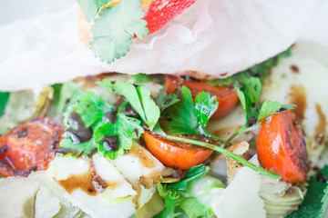 Healthy food exclusive salad according to an Italian recipe closely, composition: artichokes, lettuce, balsamic accelera, tomatoes