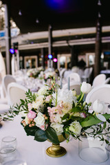 Flower arrangement on the table, wedding in summer