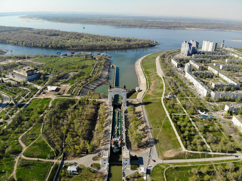 Panorama of the city of Volgograd. A cargo ship-tanker loaded with oil passes through the first lock of the Volga-Don Shipping Canal. Volgograd. Russia.