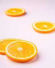 Fototapeta na wymiar Tropical background orange slices fruits