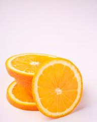 Tower of Orange slices fruit on white background