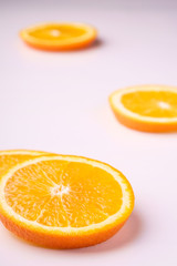 Naklejka na ściany i meble Tropical background orange slices fruits