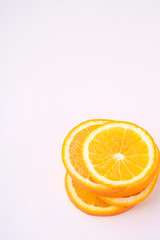 Tower of Orange slices fruit on white background