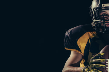 American football player on black background 
