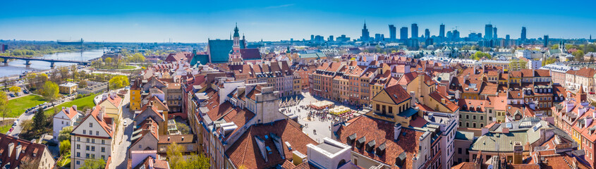 Fototapeta na wymiar Cityscape with Old city roofs and modern skyscrapers in Warsaw