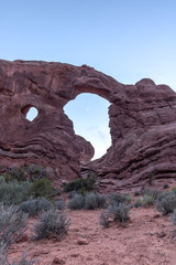 Blue dusk sky over a natural sandstone arch. Turret arch in Arches National Park, Utah.  © Scott Heaney