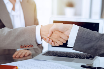 Business handshake after contract signing. Two women shaking hands after meeting or negotiation