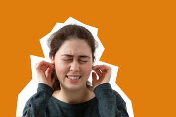 The young woman closed her eyes and covered her ears with her hands. Emotion of anger, resentment...