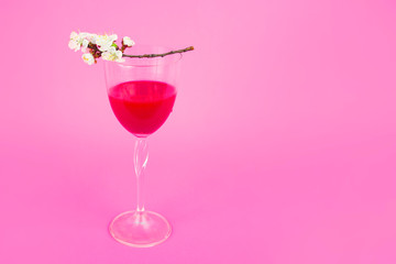 Fresh delicious cherry drink with flowers. Red cocktail with cherry. Refreshing summer drink red