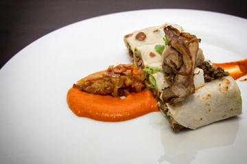 Gourmet dish with tortilla and mince on carrot puree