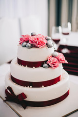 wedding cake with flowers yellow beige red turquoise blue