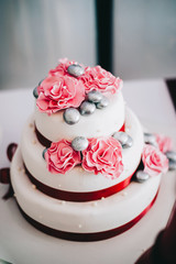 wedding cake with flowers yellow beige red turquoise blue