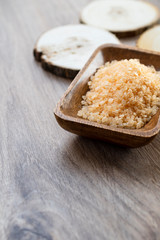Spa sea salt in wooden bowl closeup