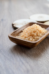 Spa sea salt in wooden bowl closeup
