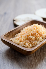 Spa sea salt in wooden bowl closeup