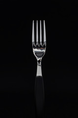 Fork on the dark background.