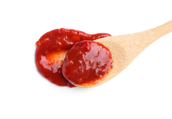 Wooden spoon and red sauce on white background, top view