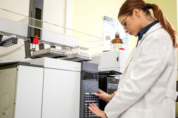 Working on chromatography with liquid woman in laboratory