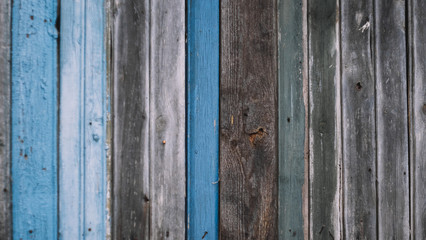 Old colorful wooden texture background, close-up. Wall of rural house. Blurred pattern. 
