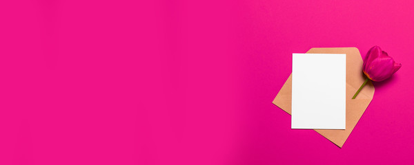 Minimalist card paper mockup with red tulip, craft envelope,