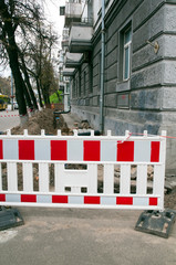 safety signs during repairs on the street and near the buildings