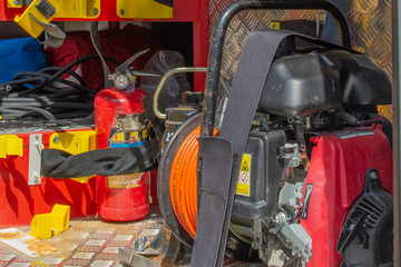 Side view of the equipment inside the fire truck. Details of rescue and fire fighting equipment.
