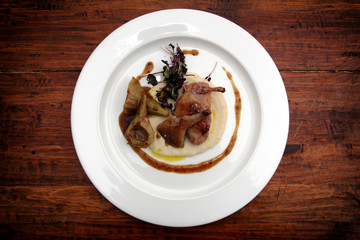 Gourmet a plate of poultry and puree with sauce