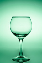 Wine glass of green gradient background