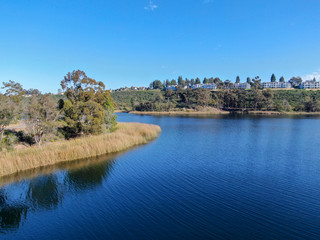 Fototapeta na wymiar Aerial view of Miramar reservoir in the Scripps Miramar Ranch community, San Diego, California. Miramar lake, popular activities recreation site including boating, fishing, picnic & 5-mile-long trail.
