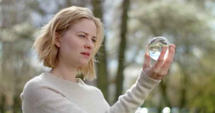 Science student is analysing a glass globe for her research
