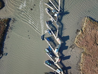 Boat arriving on a stilts pier