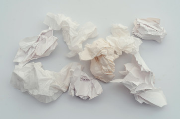 Crumpled sheets of paper, trash. Pollution, waste, ecology