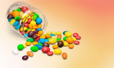 Obraz premium Assortment of colorful candies isolated on white background