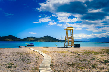 Lifeguard tower on sandy beach.