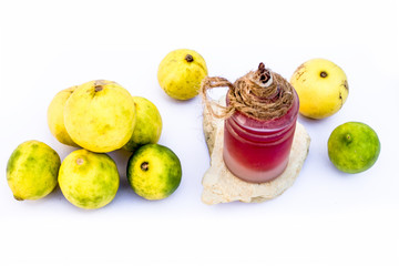 Lemon face mask isolated on white i.e. Lemon juice well mixed with fuller's earth along with the help of some rose water.Entire raw ingredients present on the surface.