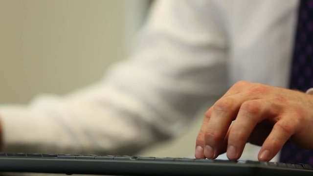 Office worker typing in data entry job, white collar worker concept scene