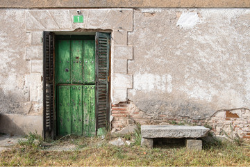 Fototapeta na wymiar Retro door and window set located in abandoned village.