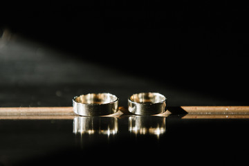 Wedding rings close-up macro shot. Rings of the bride and groom