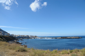 Marettimo is the wildest and most remote of the three Egadi Islands off the coast of Sicily, with white houses and blu sea.