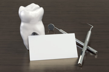 Blank business card for dental company or dentist on the wooden desk background. 3D rendering
