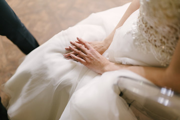 Fototapeta na wymiar Young woman posing in a white wedding dress close up