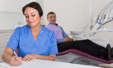 worker dentist professional sitting